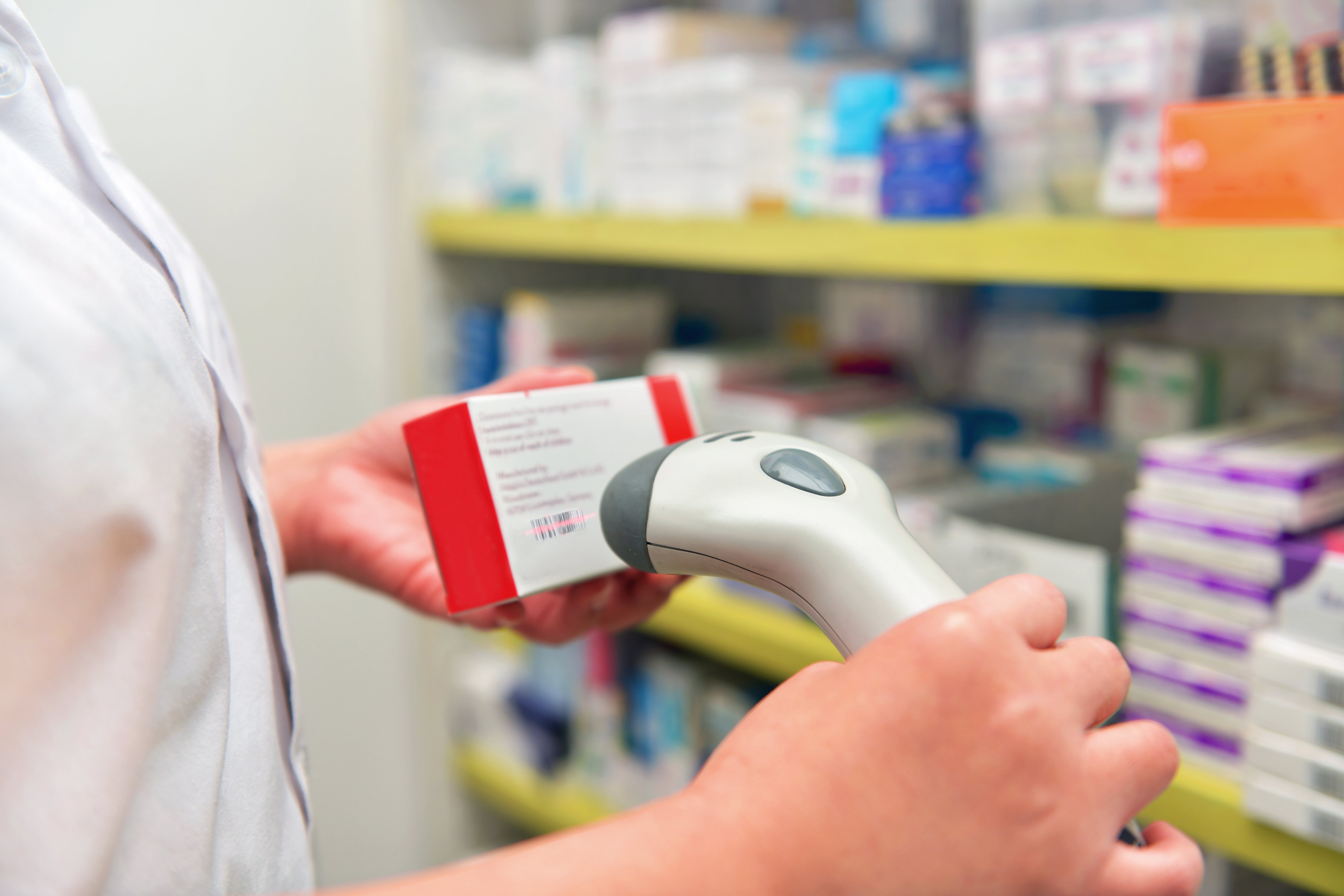 pharmacist-scanning-barcode-medicine-drug-pharmacy-drugstore